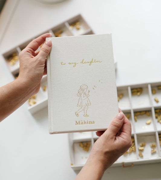 To My Daughter personalised baby journal in ivory linen with gold foil illustrated cover