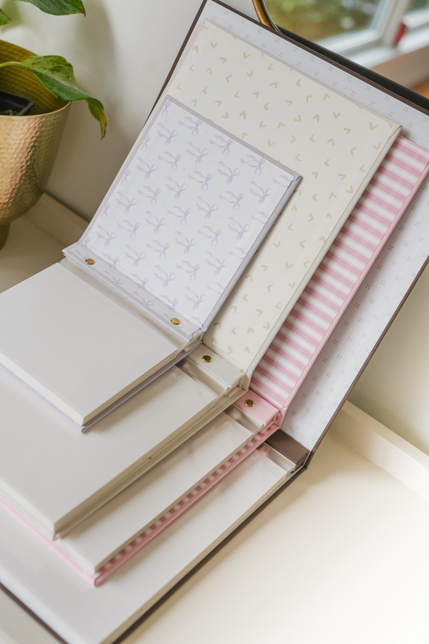 Four personalised photo album sizes compared