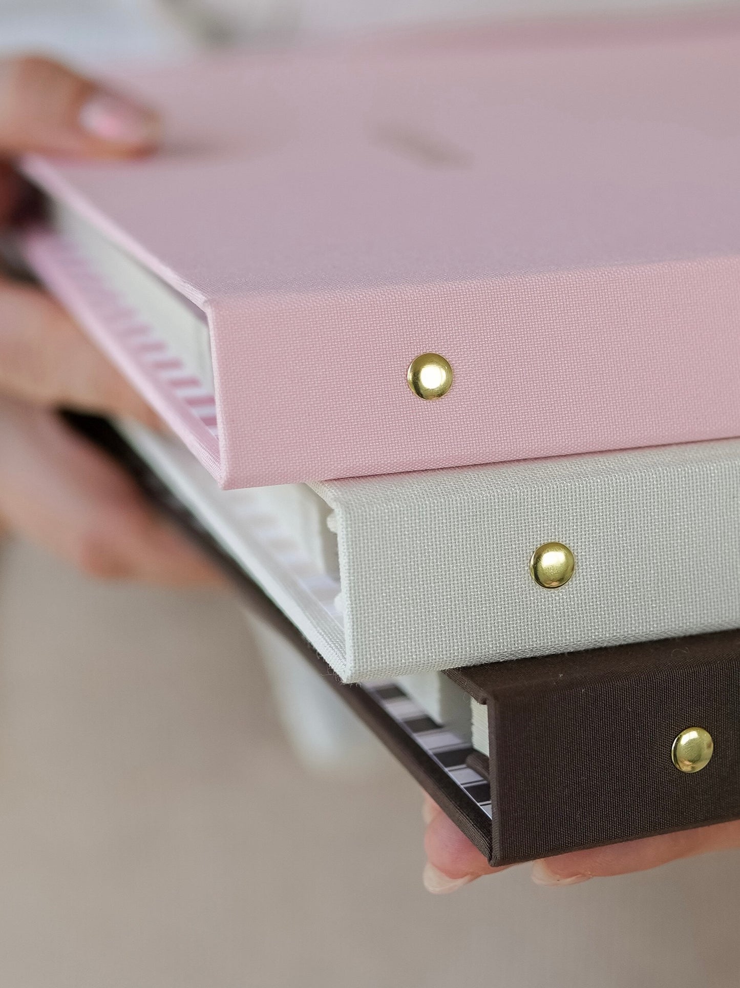 Linen spine and brass stud detail on the bespoke album
