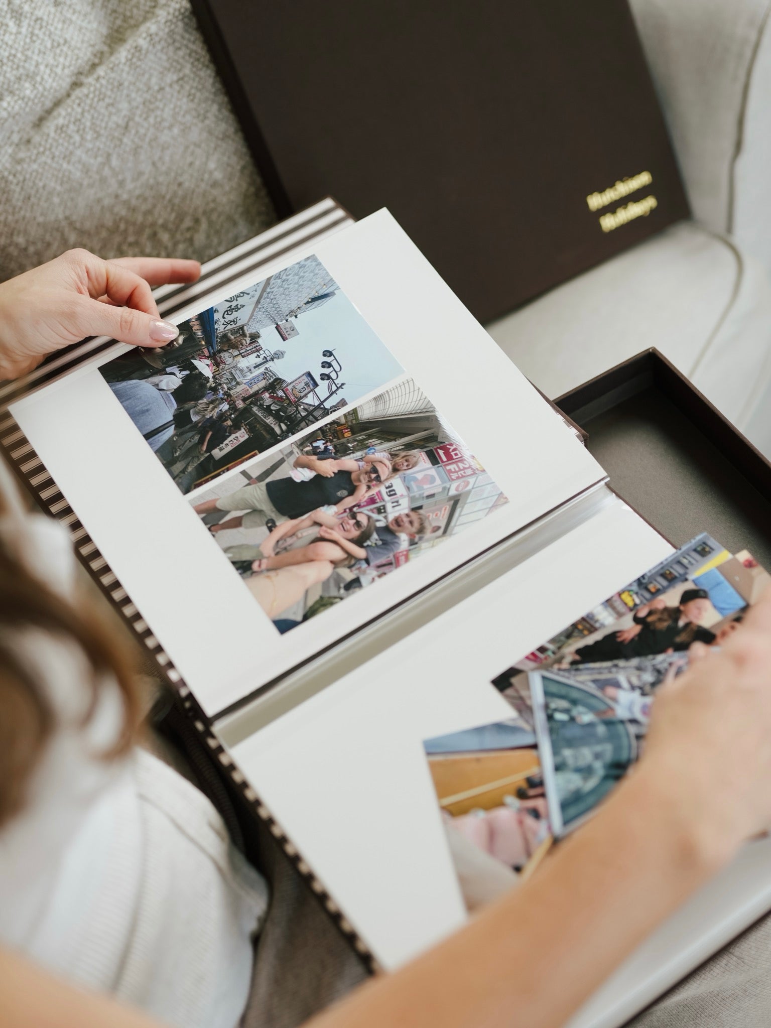 Bespoke album open beside its linen keepsake box