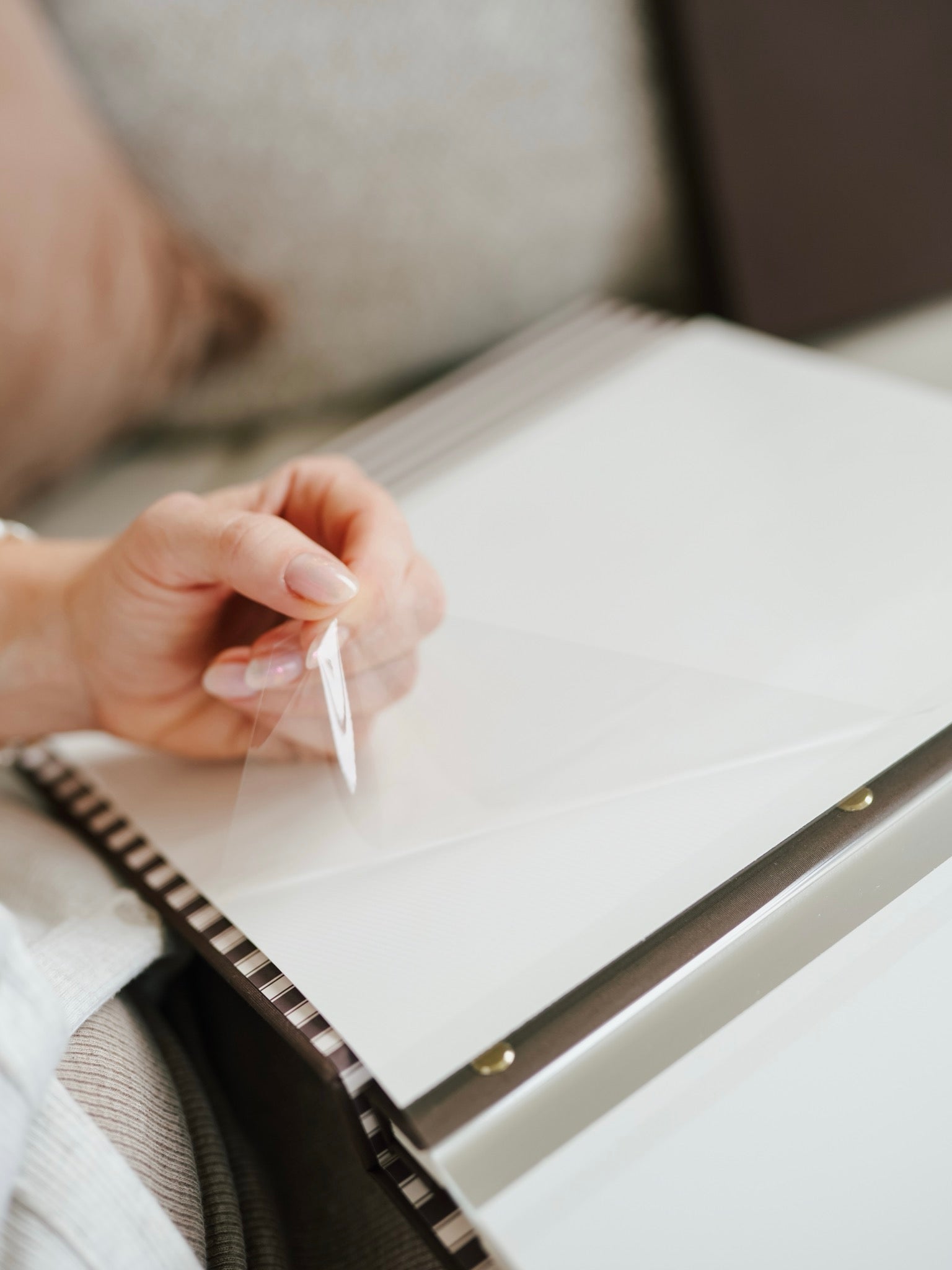 Self-adhesive peel and stick pages in the bespoke photo album