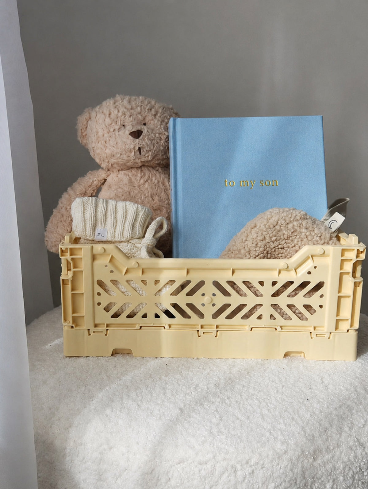 To My Son vintage blue personalised baby journal in a nursery crate with teddy bear